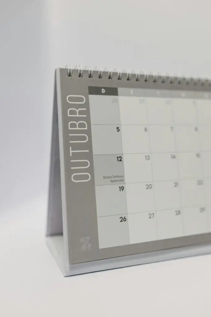 A simple and clean design of an October desk calendar with spiral binding.